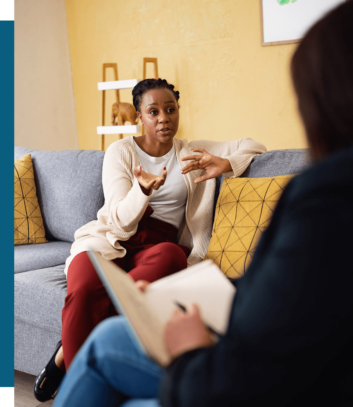 A woman attentively listens during a therapy session.